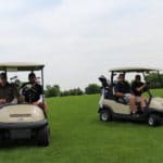 men on golf carts